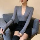 Long-sleeve Deep V-neck Knit Top / Mini A-line Skirt