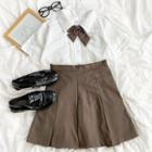 Short-sleeve Tie Neck Shirt / High-waist Pleated Mini Skirt