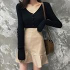 V-neck Cardigan / A-line Faux Leather Skirt