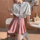 Elbow-sleeve Tie-neck T-shirt / Pleated Mini Skirt