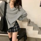 V-neck Letter Oversize Sweatshirt / High-waist Plaid Pleated A-line Mini Skirt