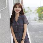 Tie-neck Frilled-hem Dotted Dress With Belt