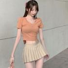 Short-sleeve Cropped T-shirt / Pleated A-line Mini Skirt