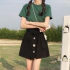 Short-sleeve T-shirt / Buttoned A-line Mini Skirt