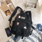 Front Pocket Buckled Canvas Backpack