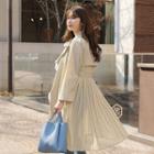 Notched-lapel Pleated-hem Trench Coat With Sash