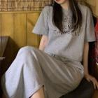 Set : Short-sleeve Lettering T-shirt + Asymmetrical Semi Skirt Gray - One Size