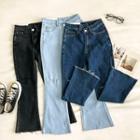 Distressed Asymmetric High-waist Jeans
