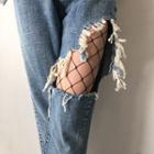 Distressed Jeans With Fishnet Tights