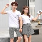 Women Set: Short-sleeve V-neck T-shirt + Striped A-line Skirt / Men Set: T-shirt + Shorts