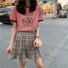 Printed T-shirt / Plaid Pleated Skirt