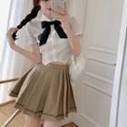 Short-sleeve Ribbon Tie-neck Shirt / Pleated Mini A-line Skirt