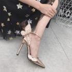 Wing-accent Pumps