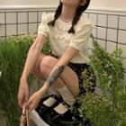 Short-sleeve Wood Ear Trim Cutout Knit Top / High-waist Floral A-line Mini Skirt
