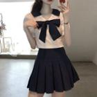 Short-sleeve Bow Accent Top / Mini A-line Pleated Skirt