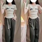 Short-sleeve Lettering Drawstring Knit Top