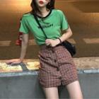 Lettering Short-sleeve T-shirt / Buttoned A-line Skirt