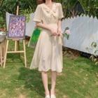 Short-sleeve Tie Neck Midi A-line Dress