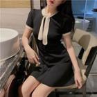 Short-sleeve Contrast Trim Buttoned A-line Mini Knit Dress