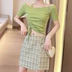 Set: Off-shoulder Top + Plaid Mini Skirt / Asymmetric Off-shoulder Cropped Top