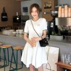 Asymmetric-hem Textured Dress