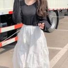 Long-sleeve Open-back T-shirt / Tiered A-line Midi Skirt