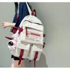 Label Applique Buckled Flap Backpack