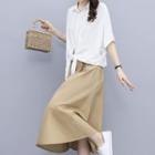 Set: Short-sleeve Tie-front Shirt + Midi A-line Skirt
