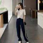 Cropped Short-sleeve T-shirt / Striped Sweatpants