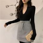Deep V-neck Long-sleeve Knit Top/ High-waist Mini A-line Skirt