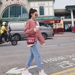 Striped Sweatshirt / Distressed Straight-leg Jeans