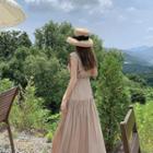 Sleeveless Button-front Shirred Dress