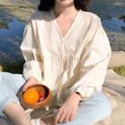 Long-sleeve Button-up V-neck Blouse