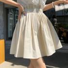 Band-waist Pleated Flare Miniskirt