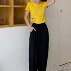 Cutout Short-sleeve T-shirt / Cropped Harem Pants