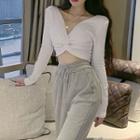 Plain V-neck Long-sleeve Top / High-waist Lace-up Pants