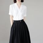 Set: Short-sleeve V-neck Blouse + Midi A-line Skirt