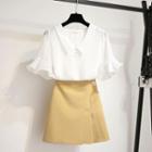 Set: Bell-sleeve Plaid Blouse + Mini A-line Skirt