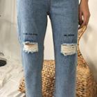Embroidered Asymmetric Distressed Jeans