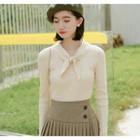 Long-sleeve Tie-neck Buttoned Knit Top Almond - One Size