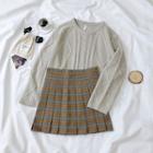 Cable-knit Sweater / Mini Plaid Pleated Skirt