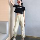 Cropped Lettering Short-sleeve T-shirt / Cuffed Straight-fit Cargo Pants