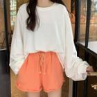 Set : Long-sleeve Round-neck Top + High-waist Shorts