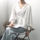 Long-sleeve Asymmetric Drawstring V-neck Blouse