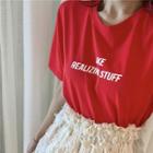 Lettering Short Sleeve T-shirt / Fringed A-line Skirt