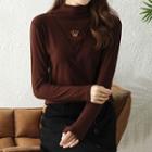 Long-sleeve Mock-neck Crown Embroidered Top