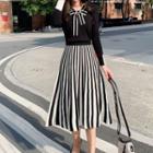 Set: Long-sleeve Tie-neck Knit Top + Striped Midi A-line Skirt