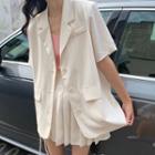 Short-sleeve Button Blazer / Mini Pleated Skirt