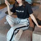 Short-sleeve Letter T-shirt / Drawstring Striped Pants