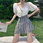 Puff-sleeve Bow Crop Top / Pleated Checkered A-line Mini Skirt